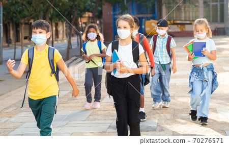 Children in masks going to school 70276571