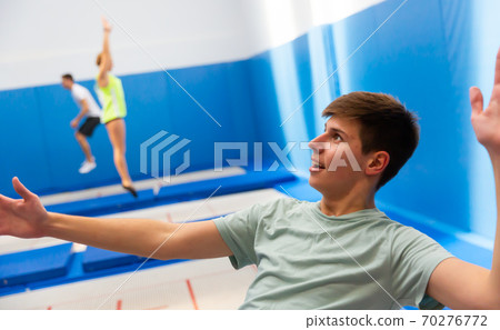 Portrait of teenager during trampoline workout Portrait of teenager during trampoline workout 70276772