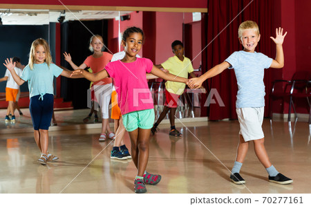 Glad children trying dancing partner dance Glad children trying dancing partner dance 70277161