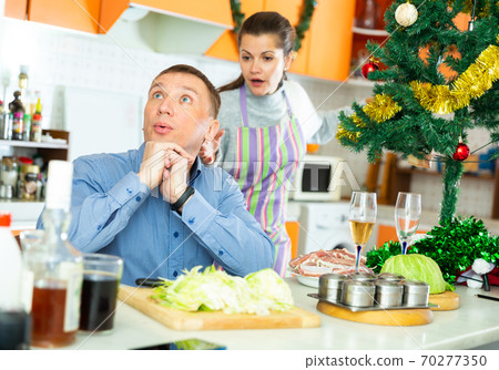 Couple quarreling at home 70277350