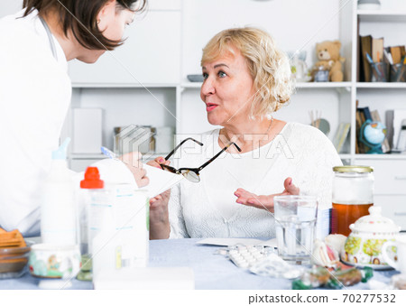 MAture woman and doctor 70277532