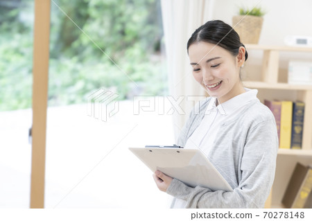 Young female caregiver 70278148