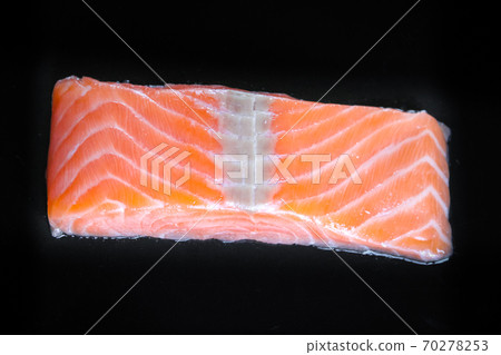 Salmon steak isolated on black background 70278253