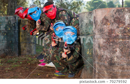 Group of nice kids playing paintball 70279592