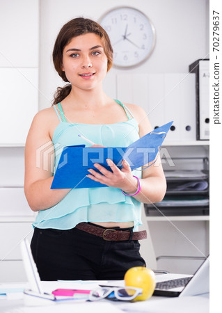 Person is signing agreement papers of financial nature 70279637