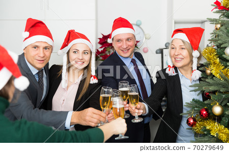 Happy business group people in santa hat at Xmas corporate party 70279649