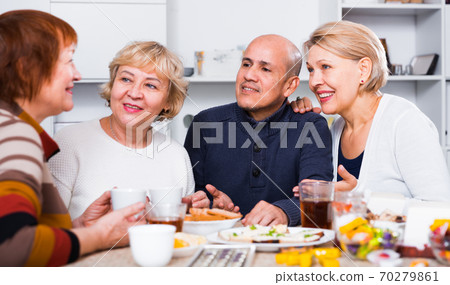 Mature friends are talking about life and drinking tea 70279861