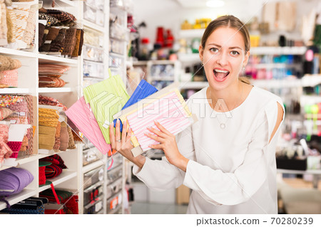 Excited girl showing ribbons Excited girl showing ribbons 70280239