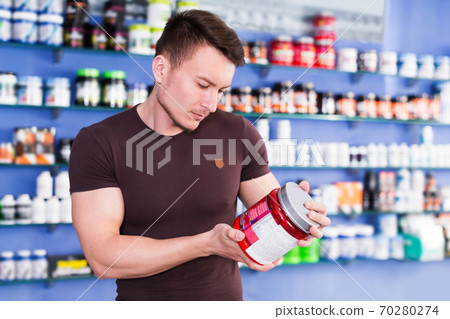 guy looking for necessary food supplements 70280274