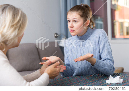 Woman scolding her daughter 70280461
