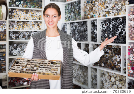 Salesgirl offering buttons Salesgirl offering buttons 70280659