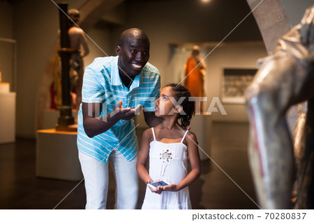 Father and daughter at hall of museum Father and daughter at hall of museum 70280837