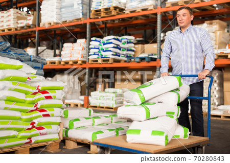Man choosing materials for home renovation Man choosing materials for home renovation 70280843