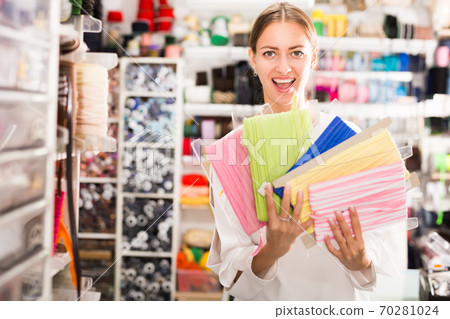 Excited girl showing ribbons Excited girl showing ribbons 70281024