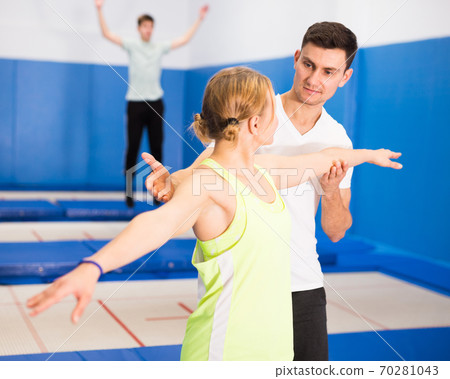 People warming up before trampoline training People warming up before trampoline training 70281043