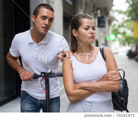 Man apologizing his offended girl Man apologizing his offended girl 70281973