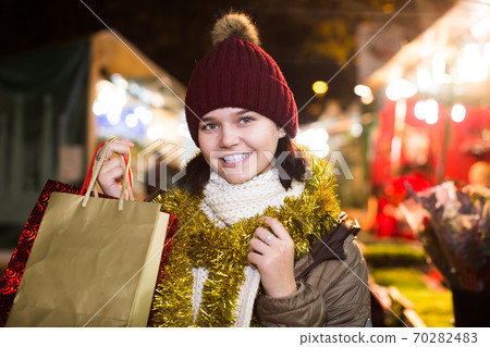 Portrait of teenage girl posing at Xmas market 70282483