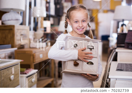 girl with curbstone in furniture store girl with curbstone in furniture store 70282739
