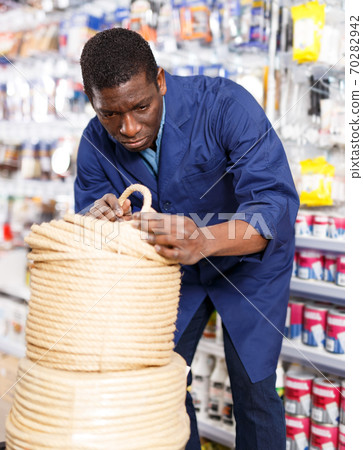 Foreman shopping in building hypermarket 70282942