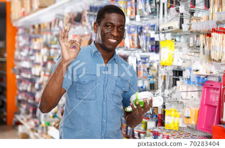 Glad African American man with purchases Glad African American man with purchases 70283404