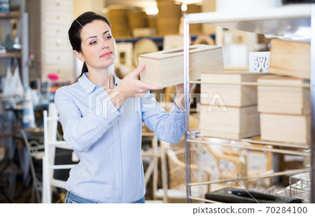female holding a wooden boxes female holding a wooden boxes 70284100