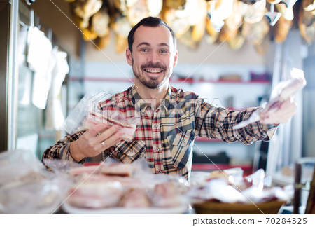 Seller offering sorts of meat 70284325