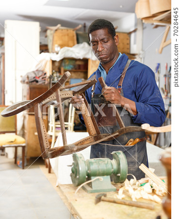 Process of renewing vintage chair 70284645