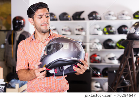 customer is choosing modern helmet 70284647