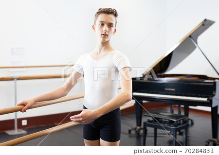 Young dancer practicing at the ballet barre Young dancer practicing at the ballet barre 70284831