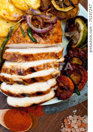roasted grilled BBQ chicken breast with herbs and spices roasted grilled BBQ chicken breast with herbs and spices 70287247