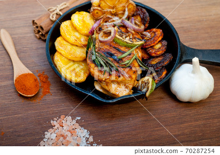 roasted grilled BBQ chicken breast with herbs and spices roasted grilled BBQ chicken breast with herbs and spices 70287254
