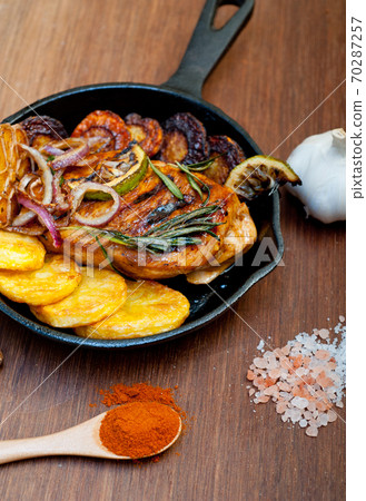 roasted grilled BBQ chicken breast with herbs and spices roasted grilled BBQ chicken breast with herbs and spices 70287257