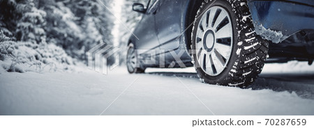 The car stopped on the snowy roadside The car stopped on the snowy roadside 70287659