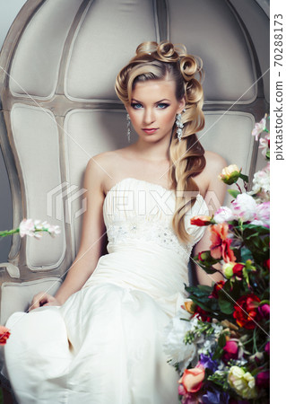beauty young bride alone in luxury vintage interior with a lot of flowers, makeup and creative hairstyle beauty young bride alone in luxury vintage interior with a lot of flowers, makeup and creative hairstyle 70288173