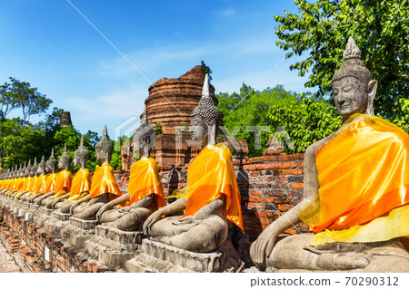 Aligned Buddha statues at Ayutthaya. 70290312
