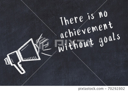 Chalk loudspeaker and wise quote on black desk Chalk loudspeaker and wise quote on black desk 70292802