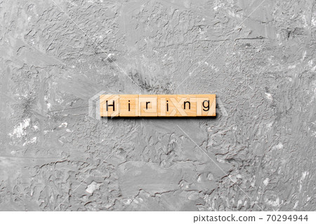 hiring word written on wood block. hiring text on table, concept 70294944