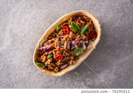 Mexican barquita taco on gray stone Mexican barquita taco on gray stone 70295812
