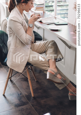 business women working and drink some coffee on the table 70296633
