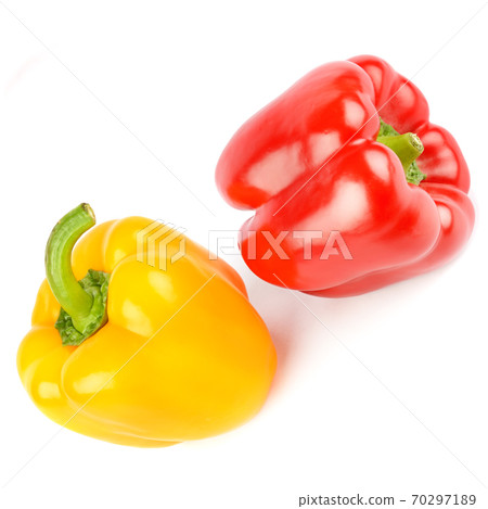 Red and yellow peppers isolated on a white . 70297189
