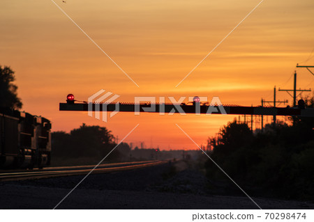 Rail Road crossing and tracks at sunset Rail Road crossing and tracks at sunset 70298474