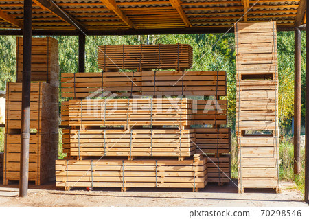 Piles of wooden boards in the sawmill, planking. 70298546