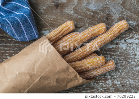Homemade spanish churros with sugar Homemade spanish churros with sugar 70299222