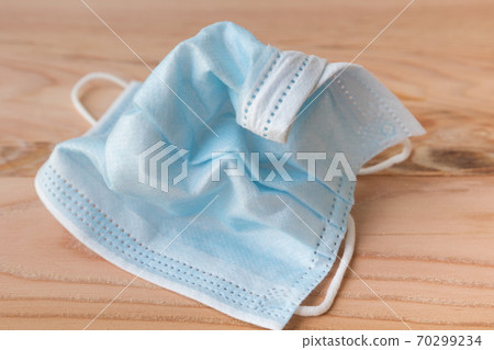 Wrinkled disposable face masks close up Wrinkled disposable face masks close up 70299234