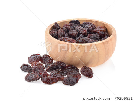 raisins in a bowl isolated on white background 70299831