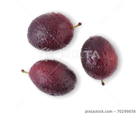 prune or plum with drop of water isolated on white background. 70299856