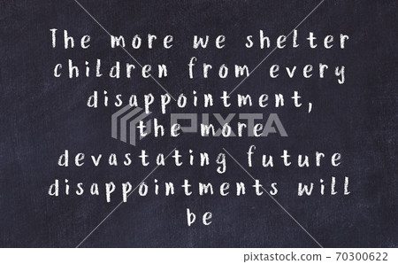 Chalk wise inscription on black chalkboard Chalk wise inscription on black chalkboard 70300622