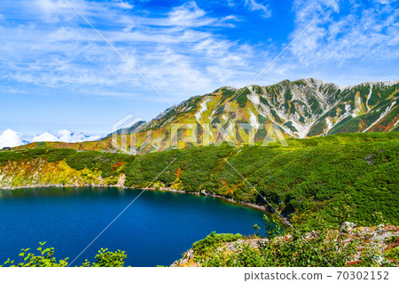 Tateyama and Bessan in autumn colors overlooking Mikurigaike 70302152