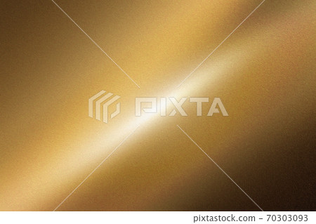 Light shining down on dark gold foil metal wall with copy space, abstract texture background 70303093