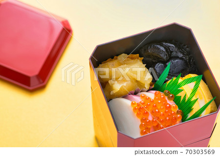 New Year dishes for one person packed in a small heavy box New Year dishes for one person packed in a small heavy box 70303569